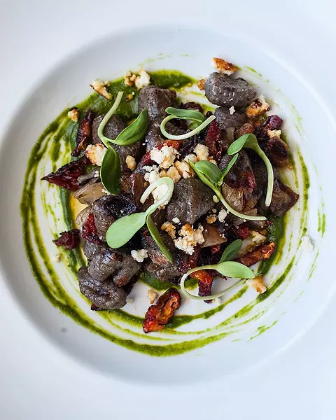Black olive gnocchi with roasted shallot, sun dried tomato, goat cheese and pumpkin seed pesto - JESSICA EMIN