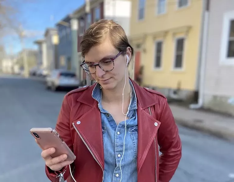 A Vista20 user tapping her way through the app-slash-play. - ALEX MCLEAN PHOTO