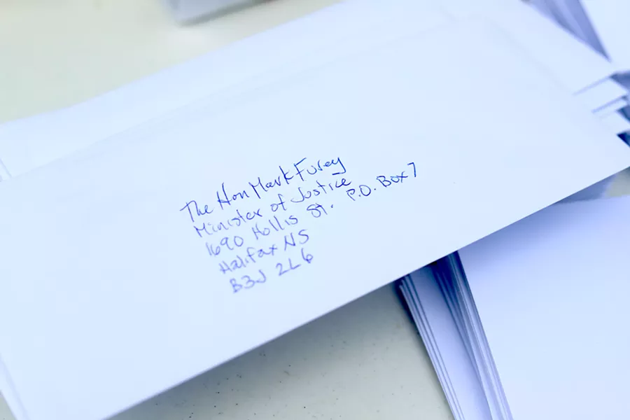 Dozens of rally attendees wrote letters to both Bill Blair and Mark Furey on Monday. - VICTORIA WALTON