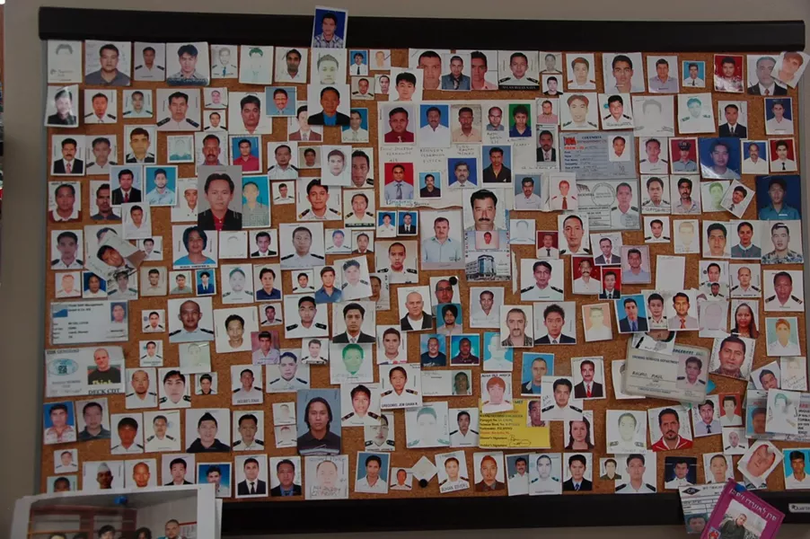 Some of the seafarers who've visited Halifax over the years, preserved as photos on this wall inside the mission. - ASHLEY CORBETT