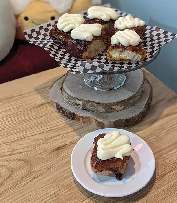 Tart & Soul's cinnamon buns have a hefty helping of cream cheese icing on top. - SUBMITTED