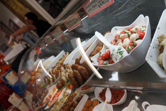 A deli counter of deliciousness at Roma Imports.