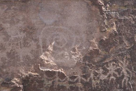 Equinox “sun dagger” on spiral petroglyph at Picture Rocks site, Pima County, Arizona