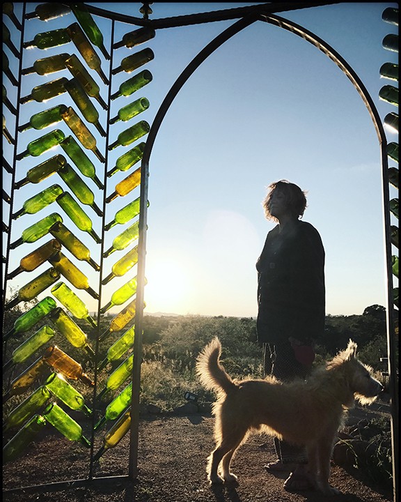 Sharon Holnback and her dog, Roscoe, at the Crystal Castle Installation created for 2018 GLOW!