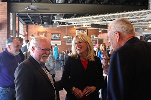 Dr. Jill Biden, the wife of Vice President Joe Biden, talks with Congressman Ron Barber and Arizona Democratic Party Chairman Bill Roe at Rincon Market as candidates entered the final stretch of Election 2014