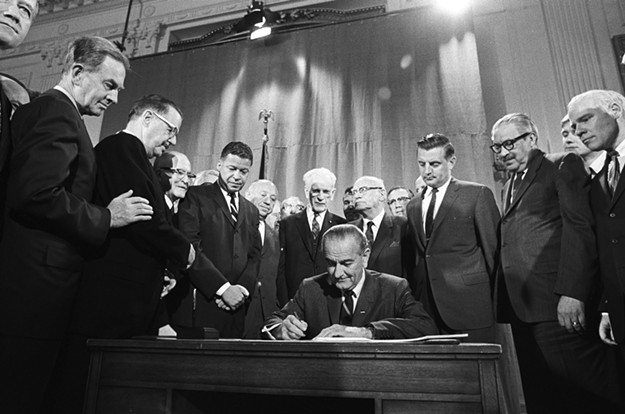 President Johnson signing Fair Housing Act into law. - COURTESY