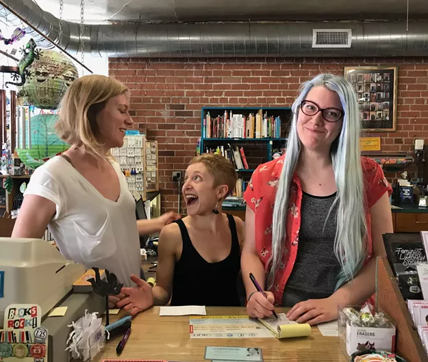 Morgan Miller, left, Kate Stern, middle, and Melissa Negelspach, Antigone Books employees, are raising the money to buy the popular indie book store on Fourth Avenue.