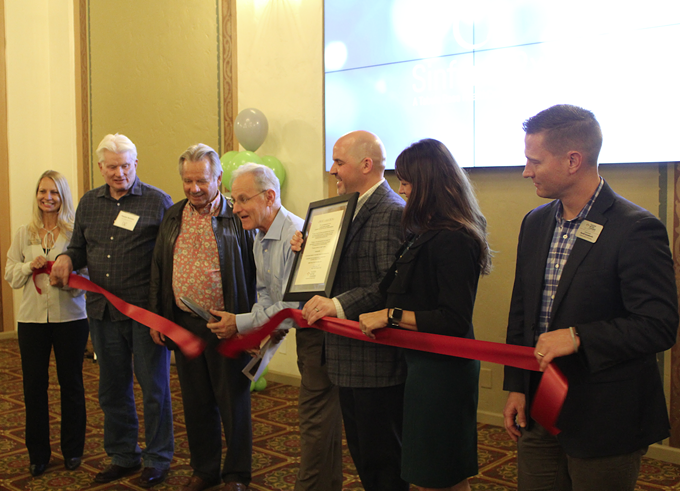 Mayor Jonathan Rothschild cuts a ribbon for the Pioneer Hotel dining room