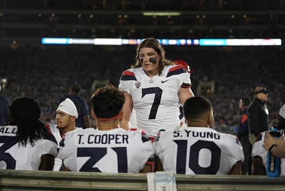 Arizona linebacker Colin Schooler chats with teammates Tristan Cooper and Scottie Young Jr. during the Wildcats' 31-30 loss to UCLA on Saturday, Oct. 20. - CONNOR BUSS, FOREWORD FILMS