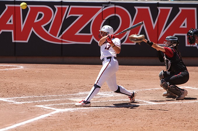 Arizona junior infielder Malia Martinez drives a pitch to left field during the Wildcats' 13-2 win over Stanford University on Saturday, April 20. - CHRISTOPHER BOAN