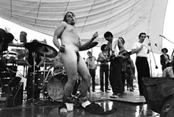 When it got too wet to safely play on the stage, some non-musicians took over the entertainment duties. - TIM FULLER