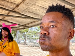 Marquez Johnson (foreground) at kickball. Jacob Wilson stands in the background. - BRIAN SMITH