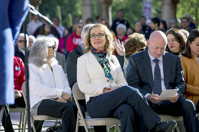 Former Congresswoman Gabrielle Giffords and her husband, retired astronaut and current U.S. Senate candidate Mark Kelly, at today's ceremony honoring those shot at Giffords' Congress on Your Corner event nine years ago. - JOHN DEDIOS