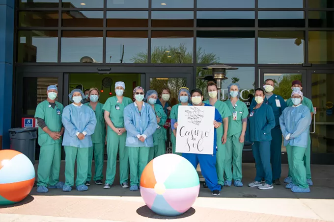 Staff holding a 'Thank You' sign at Tucson Medical Center after receiving lunch from Casino Del Sol Wednesday, April 22. - COURTESY PHOTO