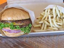 Graze double cheeseburger with a side of their fresh-cut Kennebec potatoes, fried Belgian style. Don't forget the dipping sauce! - TUCSON WEEKLY