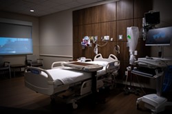 Hospitals adapt to keep beds available as surge in COVID-19 cases tests system