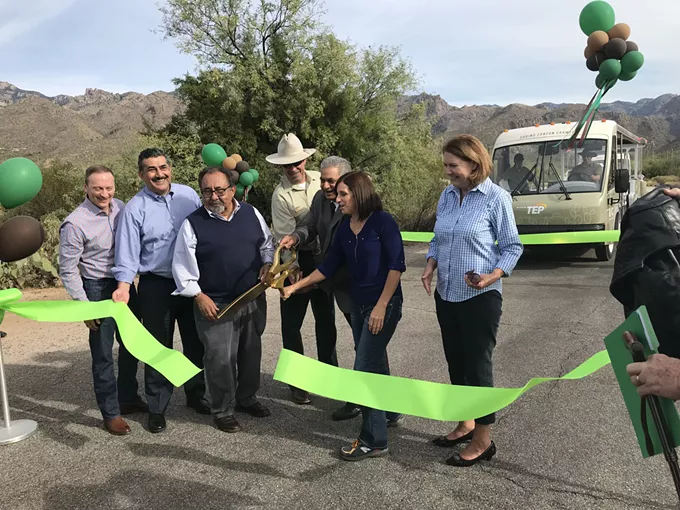 Rep. Raul Grijalva, Rep. Ann Kirkpatrick and others cut the ceremonial ribbon to inaugurate Sabino Canyon's new shuttle service in 2019. - HEIDI SCHEWEL