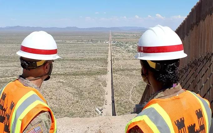 Two Army Corps of Engineers officers look down the U.S.-Mexico border near Lukeville. President Donald Trump said Thursday, suring a visit to the wall in Yuma that the 300th mile of wall would be completed soon. - GEORGE F. JOSENS/U.S. ARMY