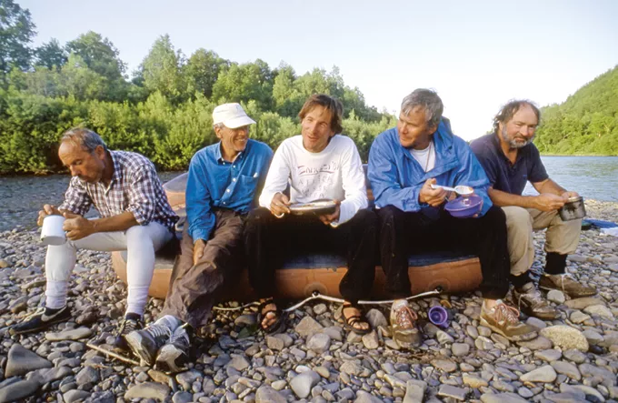 The team takes a break on the Bikin River, Russian Far East, 1992. Left to right: Yvon Chouinard, Doug Tompkins, Jib Ellison, Tom Brokaw and Doug Peacock. - PHOTO BY RICK RIDGEWAY