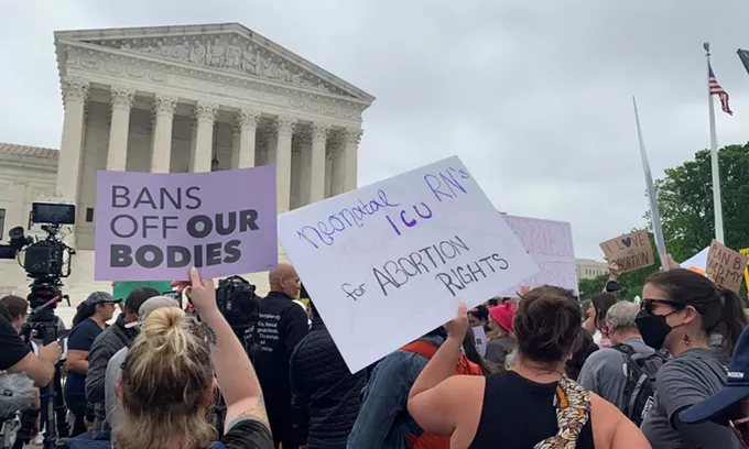 Protesters, demonstrators and activists gathered in front of the U.S. Supreme Court on Dec. 1, 2021, as the justices heard arguments in Dobbs v. Jackson Women's Health, a case about a Mississippi law that bans most abortions after 15 weeks. A draft opinion in the case shows that the court is poised to fully overturn Roe v. Wade. - PHOTO BY CHIP SOMODEVILLA | GETTY IMAGES