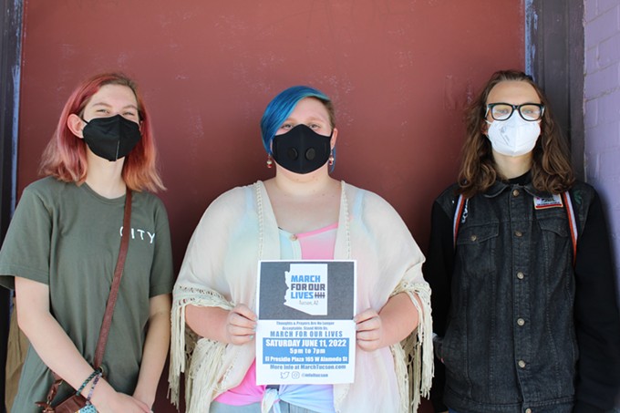 Ani ver Burg, Ellie Dorland and J.J. Williams downtown on Fourth Avenue, Friday, June 4. The three City High School students walked around hanging posters for the upcoming March For Our Lives rally on Saturday, June 11. - COURTESY PHOTO