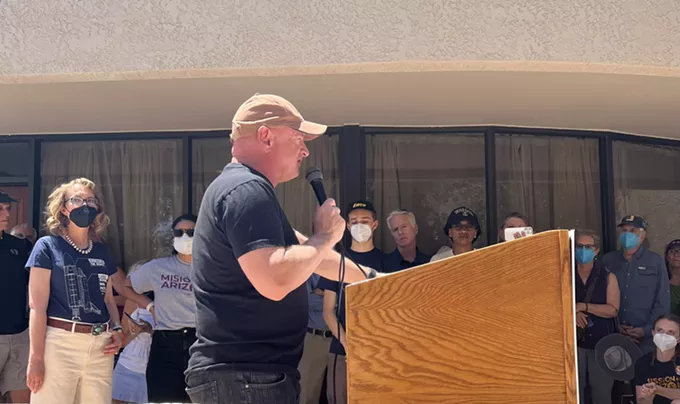 Sen. Mark Kelly, with his wife Gabrielle Giffords standing nearby, addresses a crowd as he celebrates the opening of a Tucson campaign office. Kelly is among the U.S. senators who have developed a framework for legislation to reduce gun violence. - PHOTO BY JIM NINTZEL