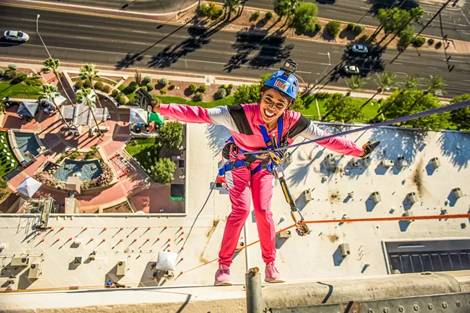 Supporters go over the edge rappelling for Girl Scouts