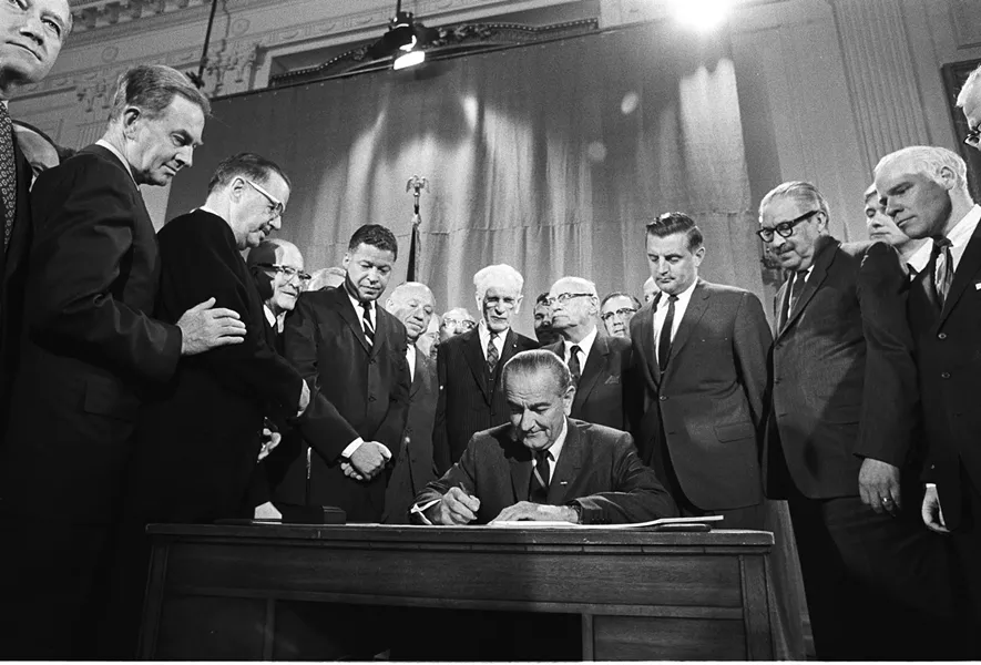 President Johnson signing Fair Housing Act into law. - COURTESY
