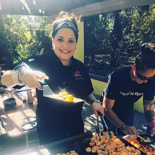 At the 2018 SAVOR Southern Arizona Food & Wine Festival, Chef Maria Mazon of BOCA Tacos Y Tequila serves up shrimp tacos splashed with kumquat courtesy of Iskashitaa Refugee Network. - PIVOT PRODUCE