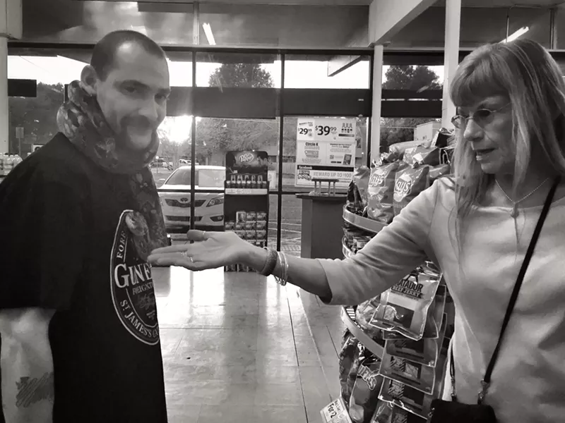 Sherman Ramsey, Satan's Little Helper and customer Debbie at Circle K. - BRIAN SMITH