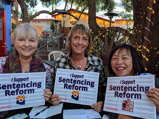 At La Cocina, friends fill out holiday greeting cards for incarcerated people in Arizona as part of the American Friends Service Committee’s push for sentencing reform.