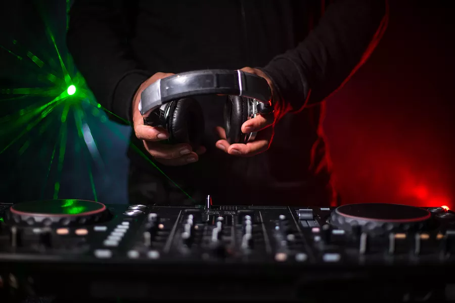 bigstock-dj-spinning-mixing-and-scrat-299427433.jpg