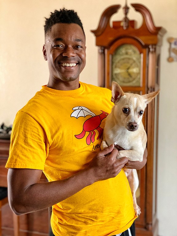 Marquez Johnson and Buster at home.