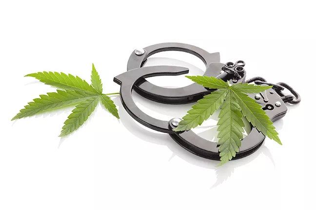 bigstock-marijuana-and-handcuffs--103372994.jpg